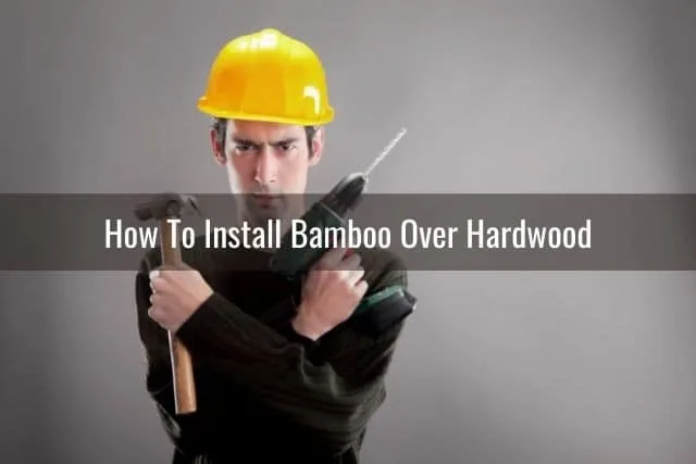 Handyman with hammer and power drill