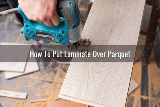 Using a saw to cut laminate floor plank