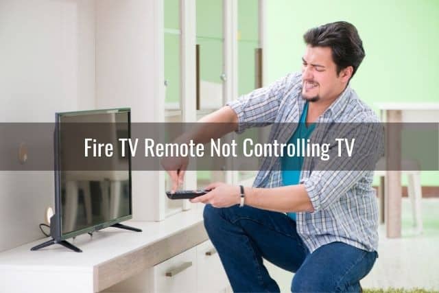 Frustrated male with TV remote that won't work