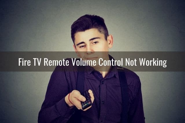 Confused male boy having trouble using TV remote