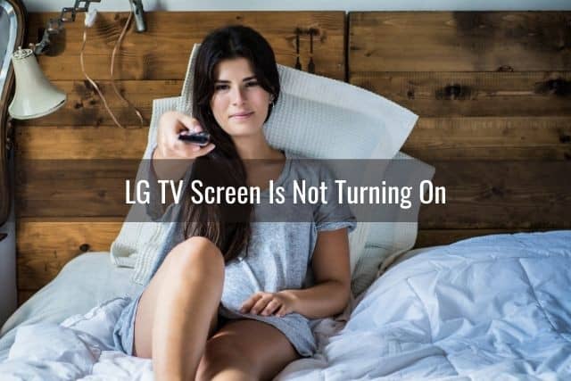 Female in bed changing TV channels with remote