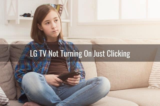 Young girl sitting on sofa changing TV channels
