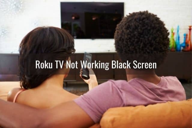 Black couple turning on TV