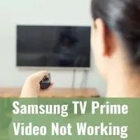 Female pointing remote at TV to turn it on