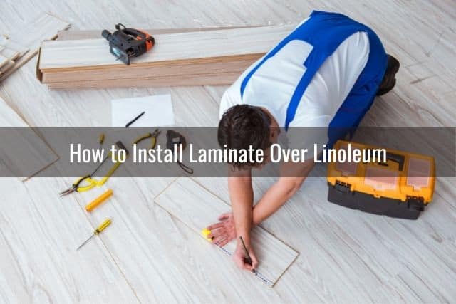 Male installing laminate flooring