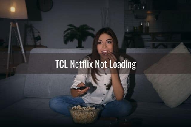 Female holding remote while watching TV movie and eating popcorn