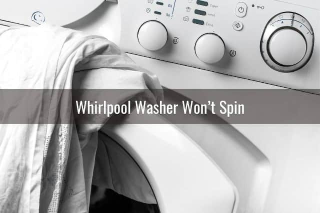 Washing machine with linens hanging out of door