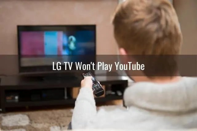 Male using remote to change TV channels