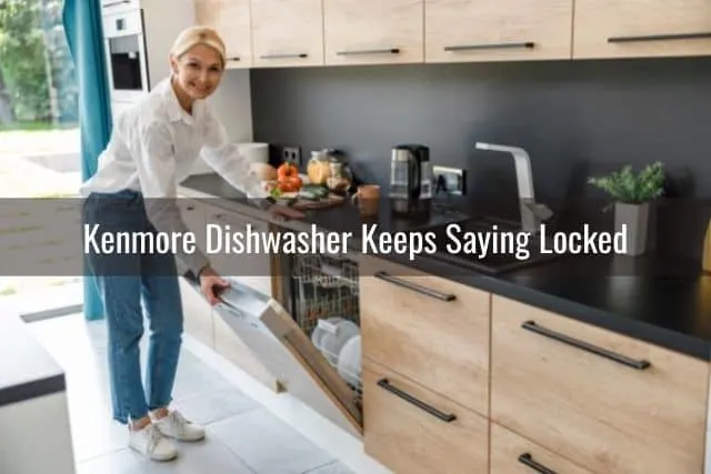 Women open kitchen dishwasher