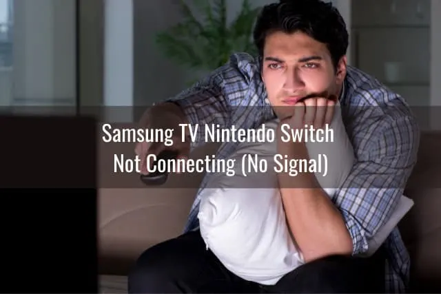 Man holding a remote the switch the channel