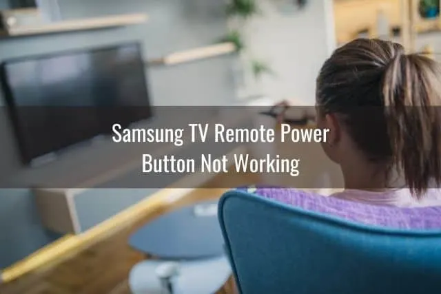 Female using remote to turn on TV