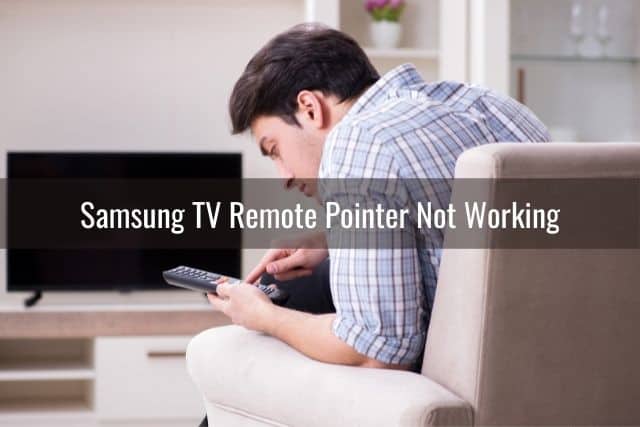Male having trouble working TV remote