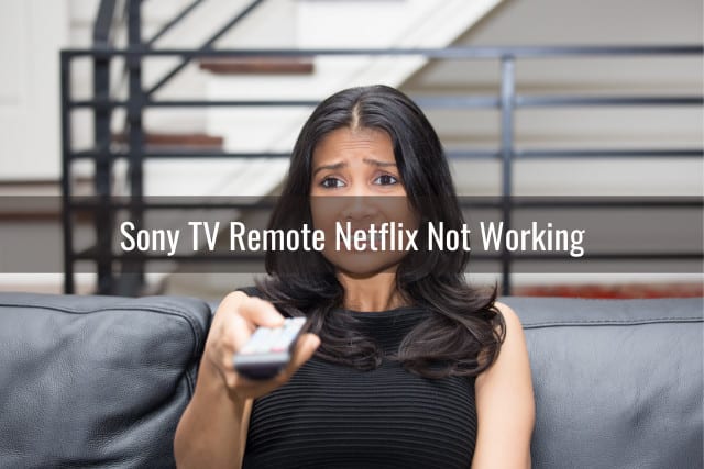 Woman is confused while holding a remote