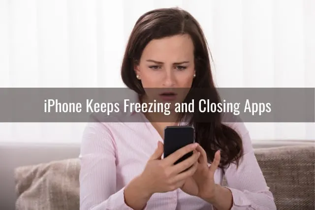 The woman is touching is phone while she is worried