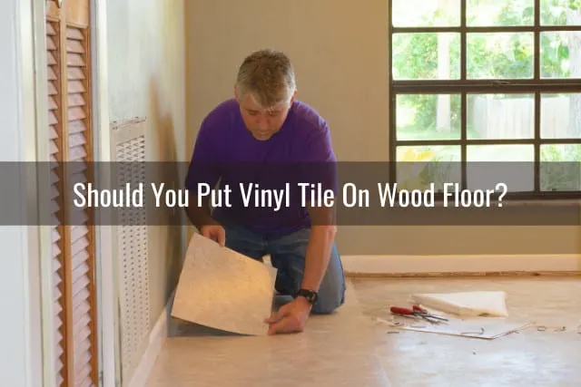 Homeowner man installing vinyl tile