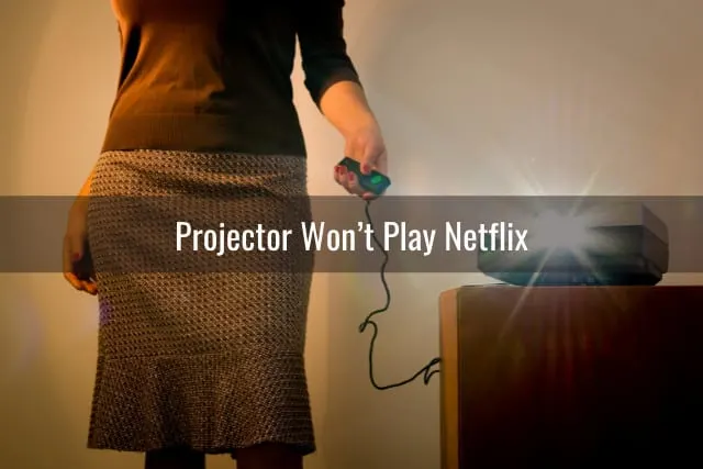 Woman holding projector remote