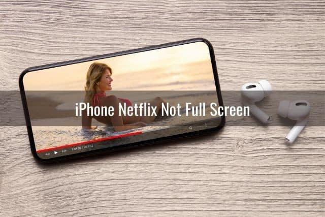 Phone on table with movie streaming