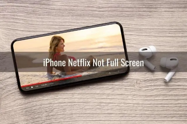 Phone on table with movie streaming