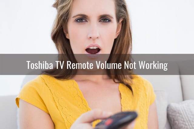Woman shocked while holding a remote