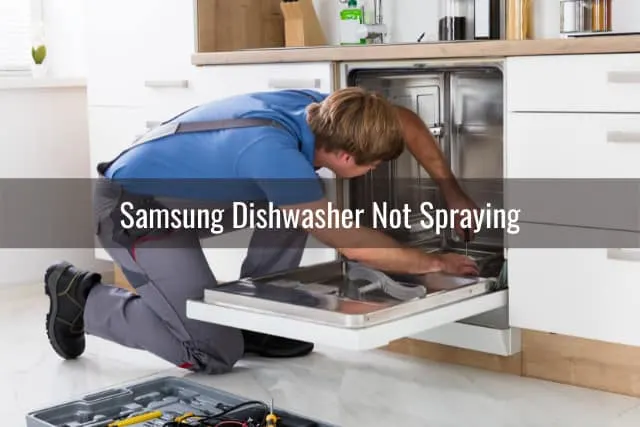 Man fixing dishwasher
