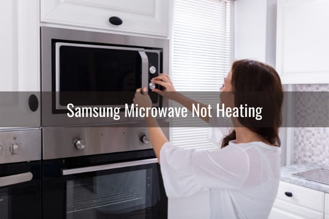 Woman checking the microwave