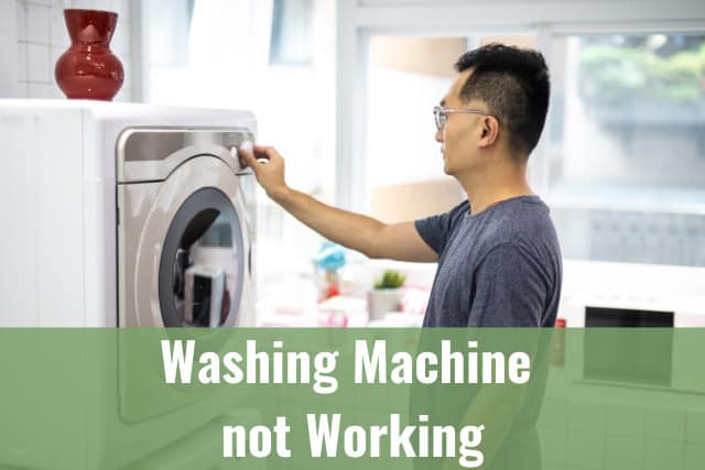 Man adjusting the start button of washing machine