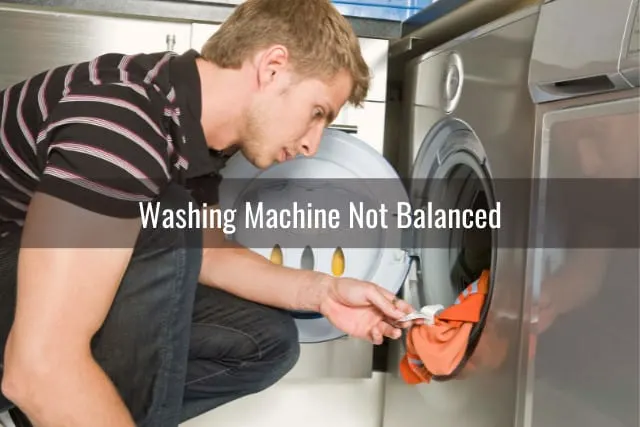 Man checking the clothes in the washing machine