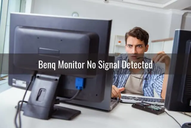 Confused man while looking at the monitor