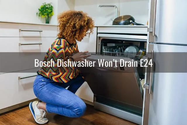 woman checking the dishwasher