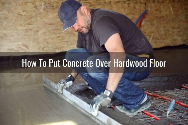 Man making smooth concrete floor installation