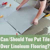 Man putting a tile on the floor