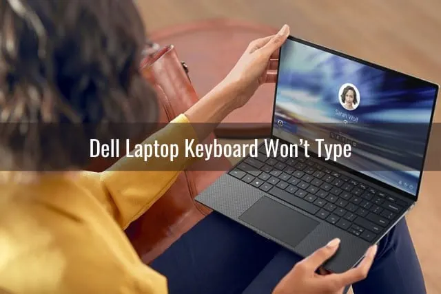 woman holding laptop on her lap