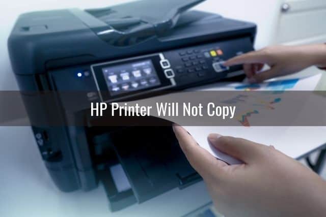 Person making photo copies on printer