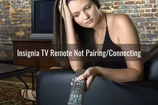 Sad woman while holding a remote