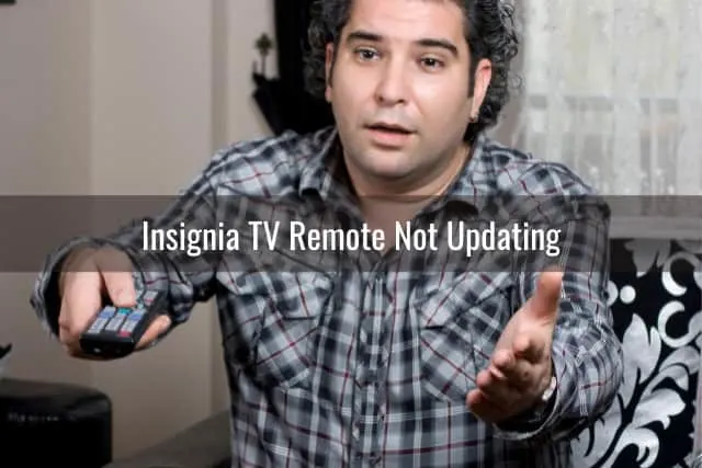 Confused man while holding a remote