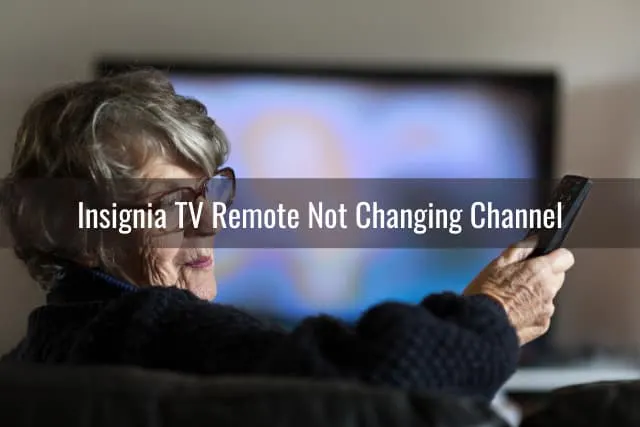 Confused old woman while looking at her remote