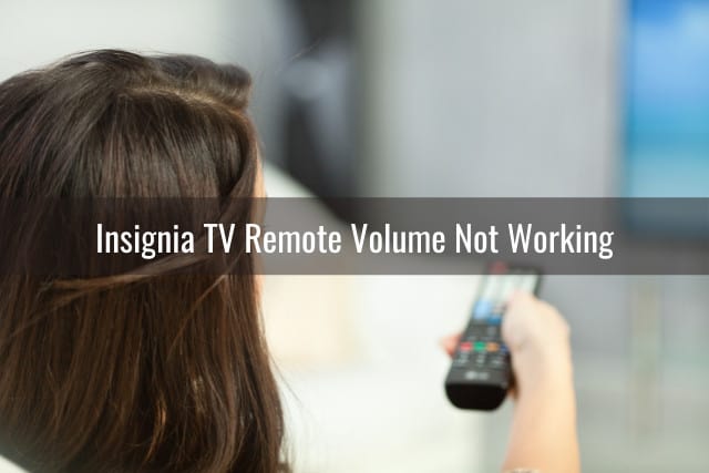 Woman holding a remote while changing the channel