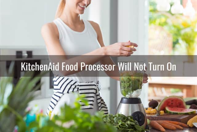 Woman using food processor for vegetables