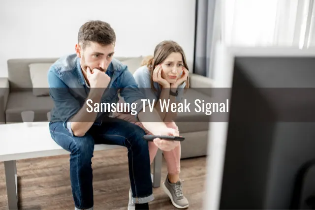 Frustrated couple watching Tv