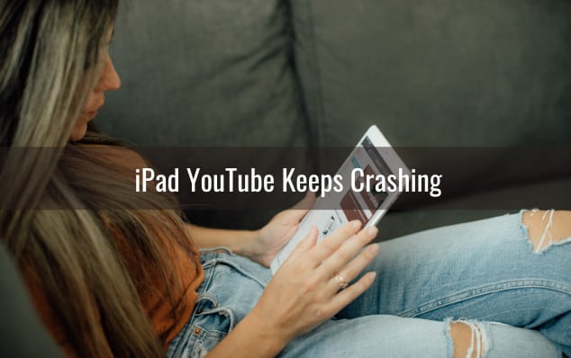 woman holding ipad while laying on the sofa