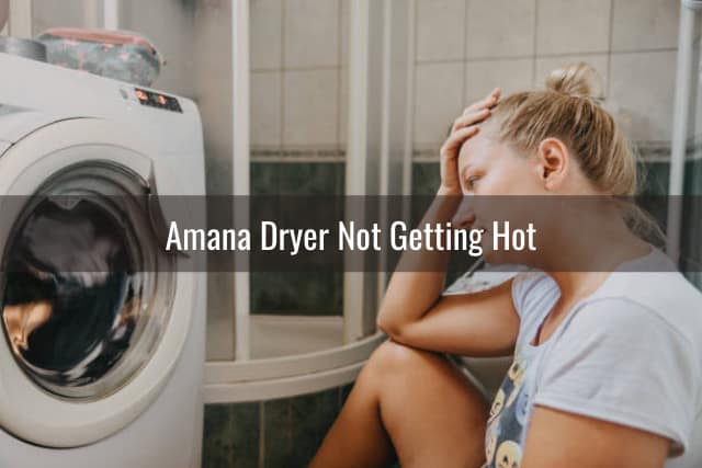Frustrated woman looking at the dryer