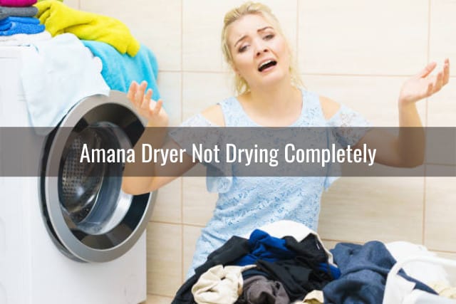 Frustrated woman looking at the dryer