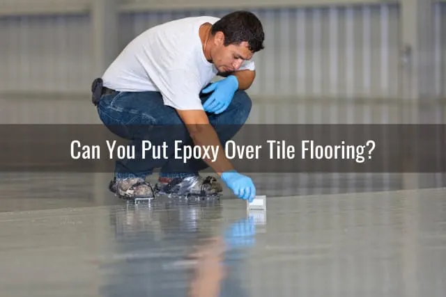 Man putting epoxy on the floor