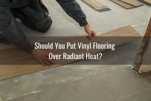 Man putting vinyl tile on the floor