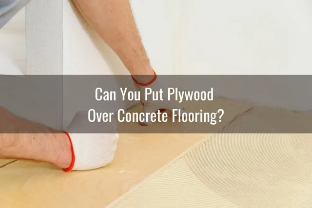 Man putting plywood on the floor