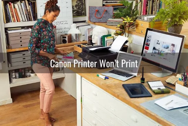 Woman standing while printer is printing