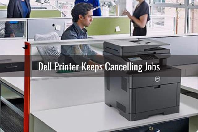 Black dell printer in the desk