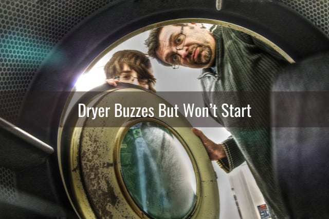 Confused man looking at the inside of dryer