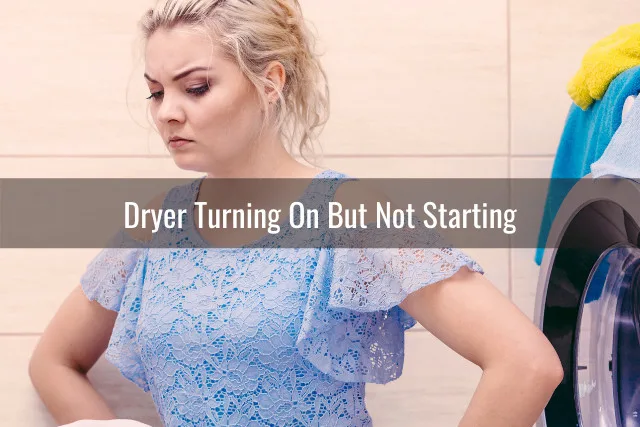 Frustrated woman behind the dryer