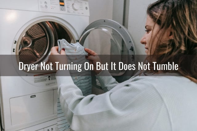 Woman checking her clothes out of the dryer